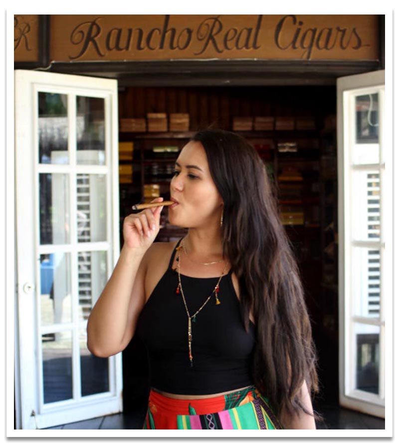 woman smoking real Dominican traditional cigar handmade.