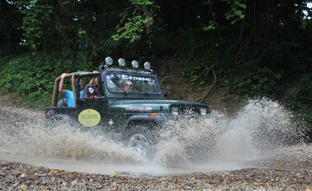 Jeeps on an adventure in Punta Cana, driving through water